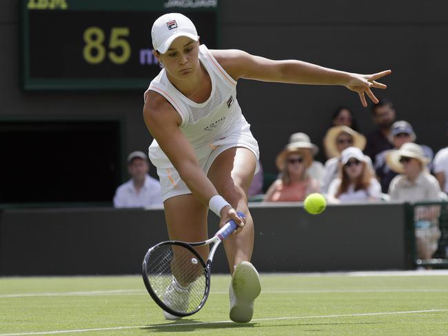 Australia's Ashleigh Barty returns to China's Saisai Zheng in their Women's singles match during day two of the Wimbledon Tennis Championships in London, Tuesday, July 2, 2019. (AP Photo/Kirsty Wigglesworth)