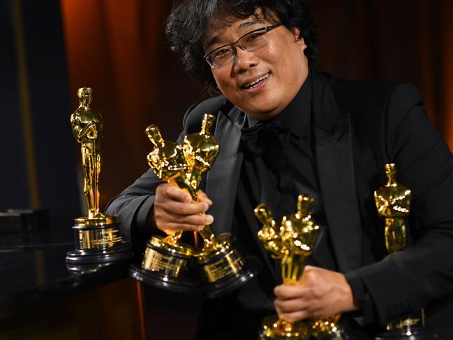 (FILES) In this file photo South Korean film director Bong Joon Ho poses with his engraved awards as he attends the 92nd Oscars Governors Ball at the Hollywood & Highland Center in Hollywood, California on February 9, 2020. - President Donald Trump on Thursday scorned the best picture Oscar for South Korean film "Parasite," asking how a foreign movie could get the honor. "How bad was the Academy Awards this year?" Trump asked the crowd at a packed reelection campaign rally in Colorado Springs, Colorado. (Photo by VALERIE MACON / AFP)