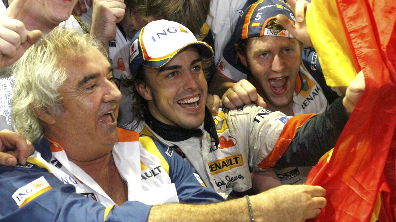 Alonso and Briatore after Singapore 2008. Photo: AP Photo/Wong Maye-E