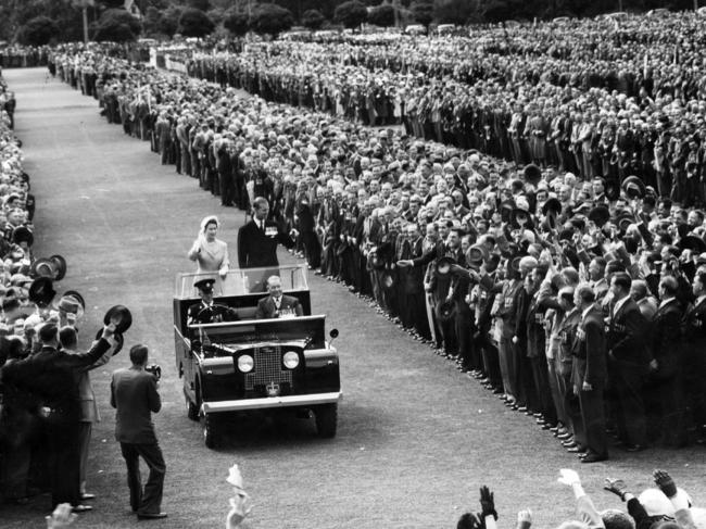 Queen Elizabeth II with Prince Philip driving past crowd of ex-servicemen and women at University Oval in Adelaide in 1954.