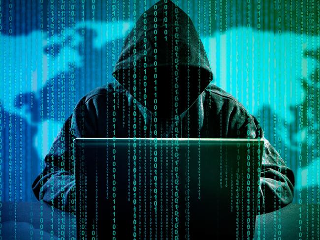 Hacker using laptop. Hacking the Internet.