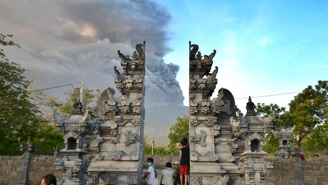 Balinese people watch Mount Agung in Kubu sub-district in Karangasem Regency. Picture: AFP