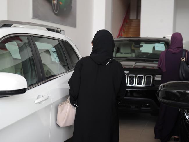 Saudi women stroll at a cars showroom in the Red Sea resort of Jeddah on June 23, 2018, a day before the lifting of a ban on women driving. Picture: AFP