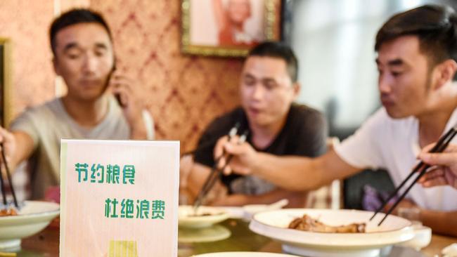 A sign encouraging people not to waste food, at a restaurant in Handan in China's northern Hebei province. Picture: AFP