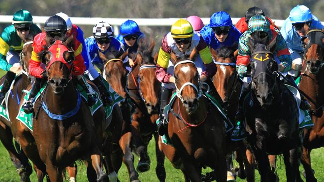 Loving home ridden by Tye Angland  (yellow cap, maroon with yellow armbands) wins race 1 during Scone  Races located in the Upper Hunter Region of NSW. The Bend . Pic Jenny Evans