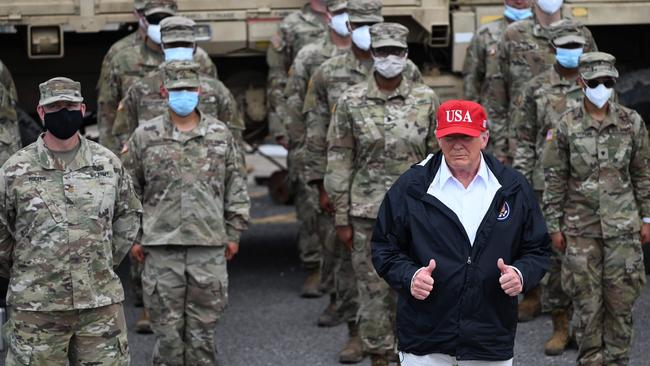 US President Donald Trump poses with National Guard troops in Lake Charles, Louisiana. Picture: AFP