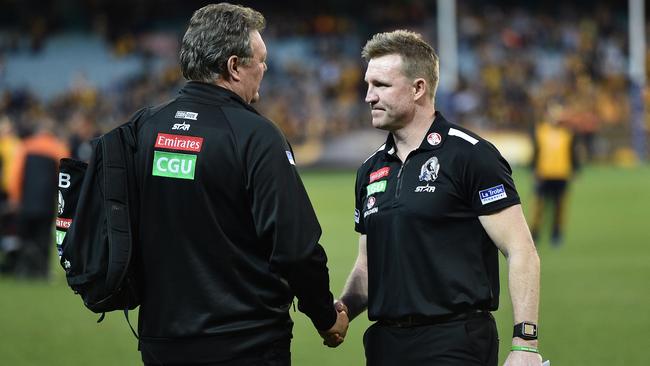 Neil Balme and coach Nathan Buckley shake handsafter Collingwood’s Round 23 loss to Hawthorn. Picture: Getty Images.