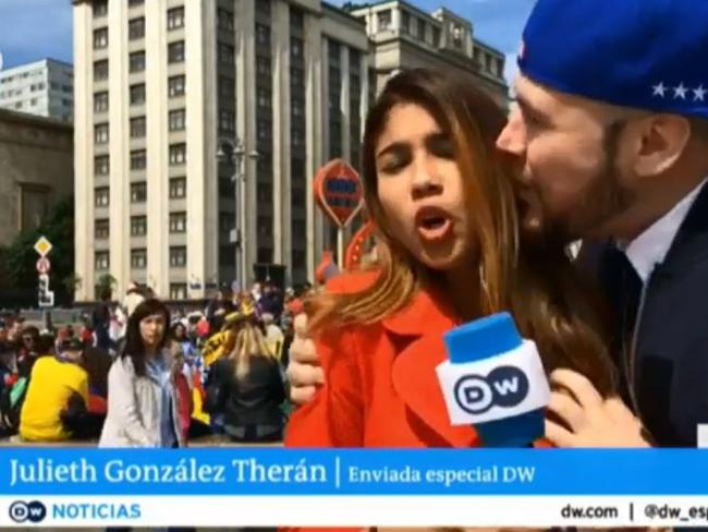 The fan runs up to TV reporter Julieth Gonzalez Theran.