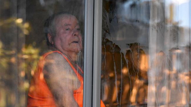 A resident looks from an aged care facility in the Melbourne suburb of Maidstone. Picture: y William West / AFP