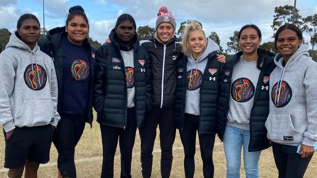 Previous participants in Essendon’s First Nations Women's Pathway Program visited Melbourne for a football clinic in May/June 2021. They spent two weeks in Melbourne before returning home due to the lockdown. Pictured L-R: Aggie Singh, 20, Molly Althouse, 19, Freda Puruntatameri, 22, Kaitlyn Ashmore from North Melbourne AFLW, Courtney Ugle, Iesha Rondberg, 18, and Alana Combes, 22. Picture: supplied