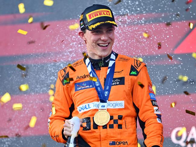 BAKU, AZERBAIJAN - SEPTEMBER 15: Race winner Oscar Piastri of Australia and McLaren celebrates on the podium during the F1 Grand Prix of Azerbaijan at Baku City Circuit on September 15, 2024 in Baku, Azerbaijan. (Photo by Dan Mullan/Getty Images)