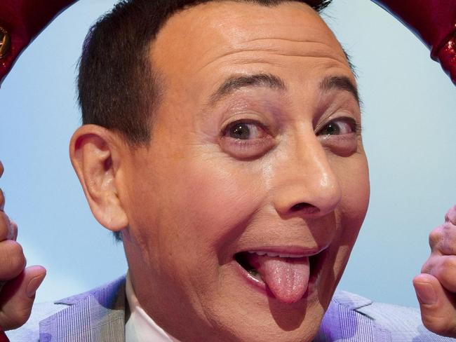 In this Friday, Oct. 29, 2010 photo, Paul Reubens, in character as Pee-wee Herman, poses on stage after a performance of "The Pee-wee Herman Show" on Broadway in New York. (AP Photo/Charles Sykes)