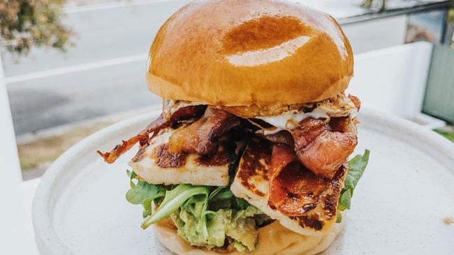 The haloumi and egg burger with added bacon at Palm Spring Burleigh.