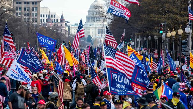 Not a mask in sight, as supporters of US President Donald Trump participate in the Million MAGA March to protest the outcome of the 2020 presidential election. Picture: AFP