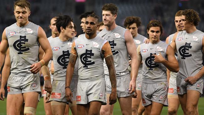 Patrick Cripps (left) leads the Blues from the field after the Round 17 AFL match between the St Kilda Saints and the Carlton Blues at Etihad Stadium in Melbourne, Friday, July 13, 2018. (AAP Image/Julian Smith) NO ARCHIVING, EDITORIAL USE