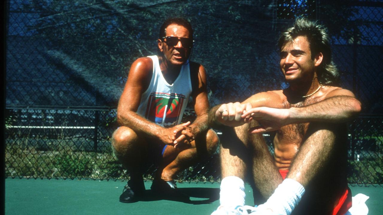 Tennis Coach Nick Bollettieri Dies Aged 91. Andre Agassi sits with Bollettieri. November 15, 1990. Photo by John Russell/Getty Images.