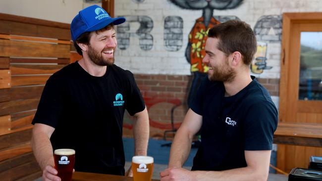 DJ McCready (left) having a bit of a laugh over a beer with Tom O’Halloran, one of the top rock climbers in Australia. Picture: Angelo Velardo