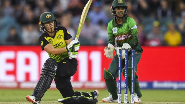 Alyssa Healy swings the ball to the legside during Thursday night’s victory over Bangladesh at Manuka Oval. Picture: AAP