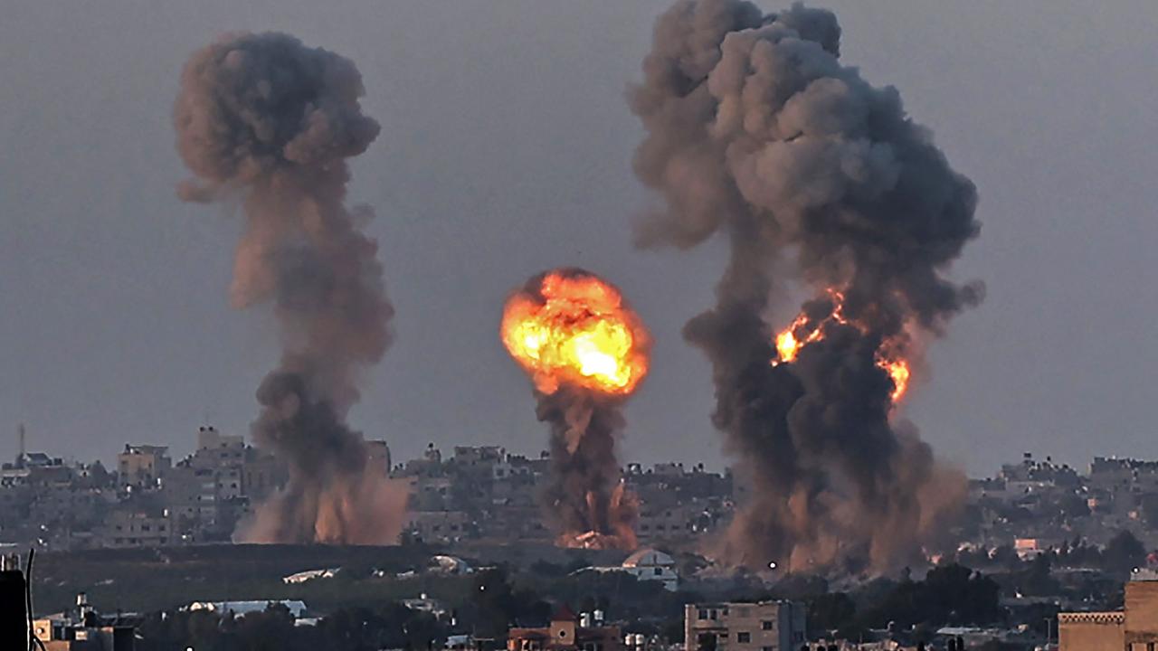 Smoke and a ball of fire rise above buildings in Khan Yunis in the southern Gaza Strip, during an Israeli air strike, on May 12. Picture: Said Khatib/AFP