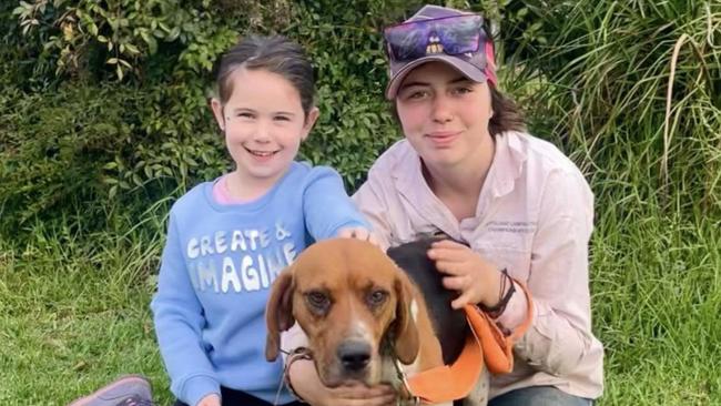 Ellie with Chelsea and her beagle, Roxy, on Thursday morning after Roxy was rescued from the mine shaft in Victoria’s high country. Picture: Supplied