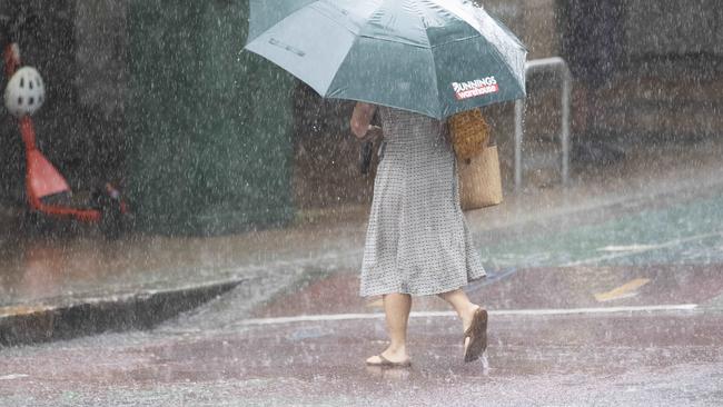 People heading out to vote on Saturday should take an umbrella, with rains to continue before clearing on Sunday. Picture: News Corp/Attila Csaszar)