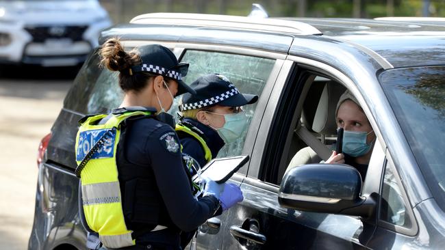 The optics of checkpoints and document demands throw back to police states more notorious than the ‘disappearings’ of today’s China. Picture: Andrew Henshaw