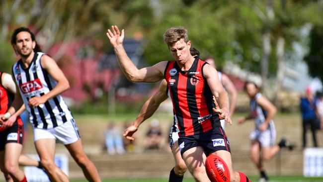 Former Sturt captain Michael Coad, pictured kicking the ball for Rostrevor Old Collegians in last year’s grand final win over Payneham Norwood Union, kicked two goals in the clubs’ rematch on Saturday. Picture: AAP/ Keryn Stevens.