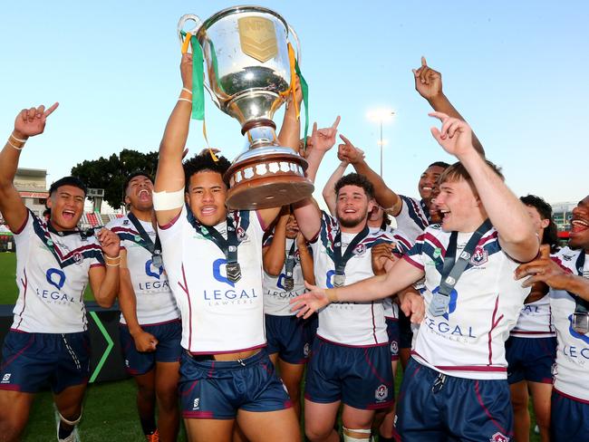 National Schoolboys Cup rugby league grand final between Ipswich SHS (white shirt) and Patrician Brothers Fairfield. - Ipswich Captain Josiah Pahulu holding trophy Redcliffe 14th September 2022 Picture David Clark