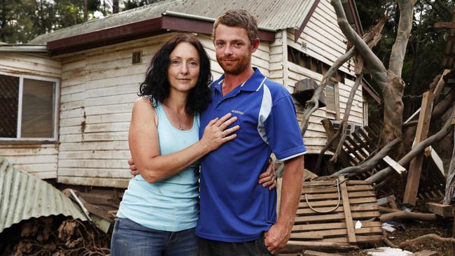 Mitch Moore and Heather Lickiss had to cut a hole in the corrugated roof to escape and be rescued by boat. Picture: Jonathan Ng