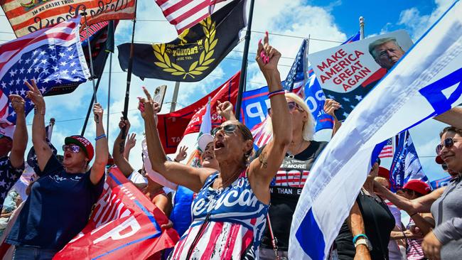 Supporters of former US President Donald Trump hold flags as they show their support for the Republican 2024 presidential candidate during a "Caravan for Trump" demonstration in West Palm Beach, Florida, on June 2. Picture: Giorgio Viera/AFP