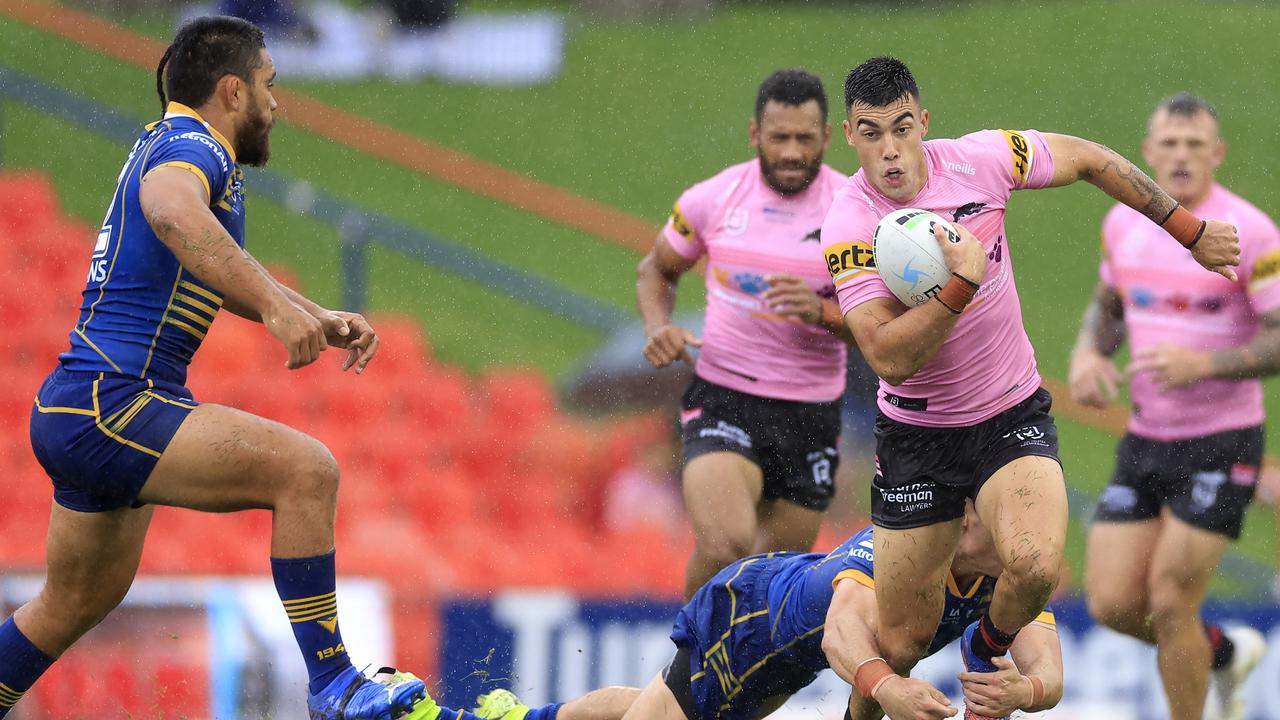 Charlie Staines tres to break free of the Panthers’ defence. Picture: Mark Evans/Getty Images