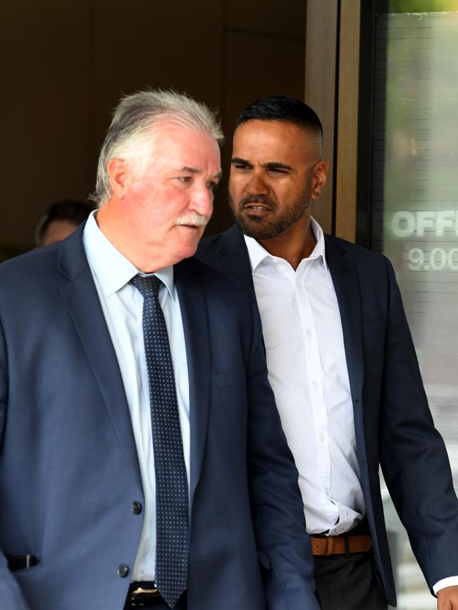 Ex-Essendon footballer Andrew Lovett with his lawyer Bernie Balmer leaving court. Picture: Penny Stephens