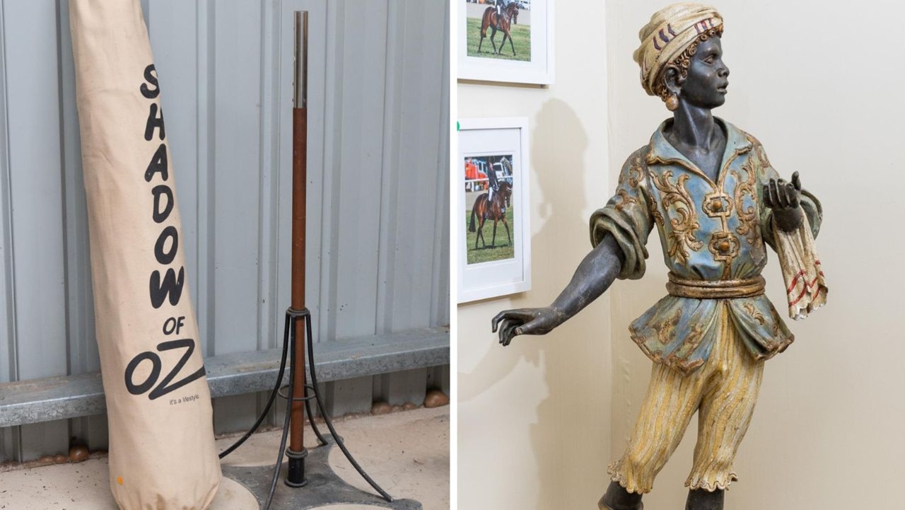 Jones is selling a Shadow of Oz umbrella for $40-$60 and a painted plaster blackamoor for $800-$1200. Picture: Lawsons Auctioneers