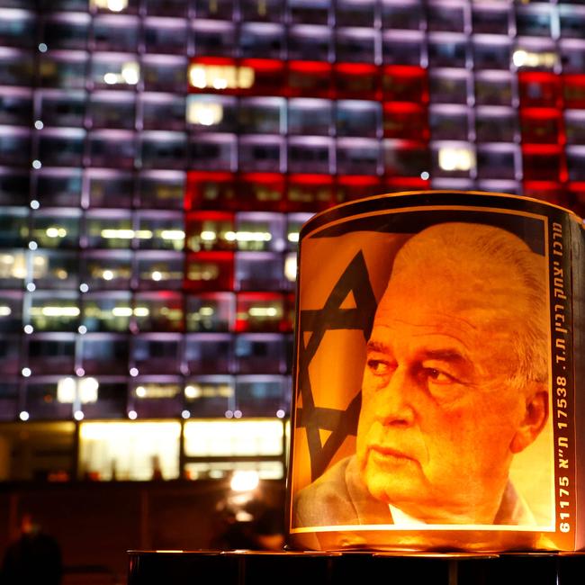 Portrait of former Israeli Prime Minister Yitzhak Rabin is seen at Rabin Square in the Israeli coastal city Tel Aviv, during a 25,000 candle vigil. Photo: JACK GUEZ / AFP.