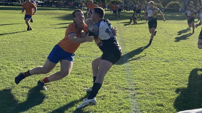 Marist College Ashgrove centre Tasman Barry tackling Iona College centre Sully Hoad.