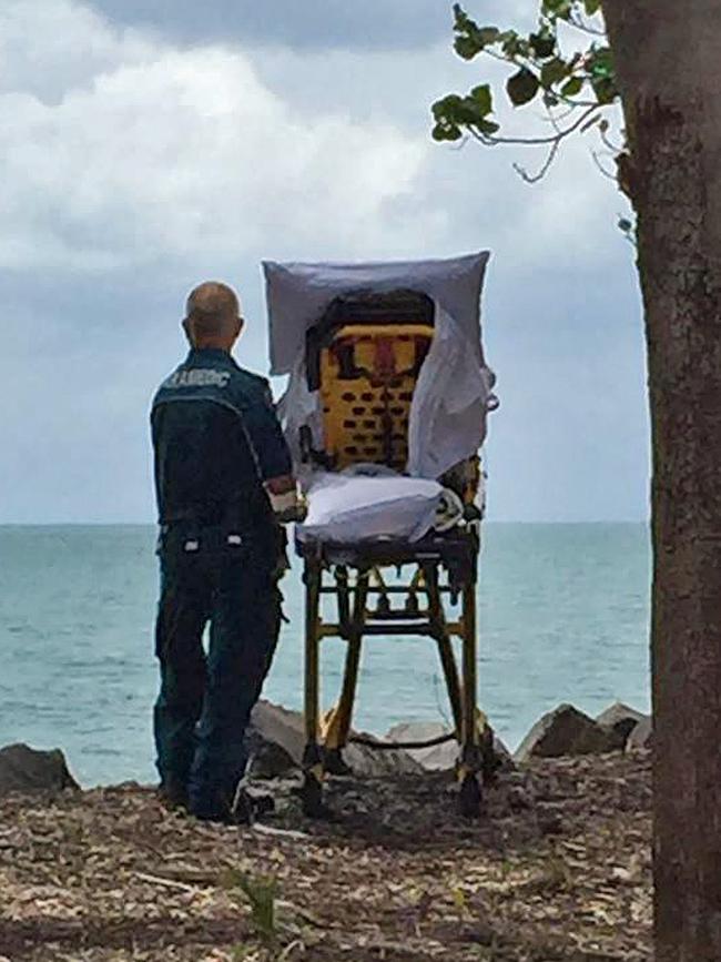 Ambulance officer Graeme Cooper standing beside Joyce on her final trip to her beloved Hervey Bay foreshore.