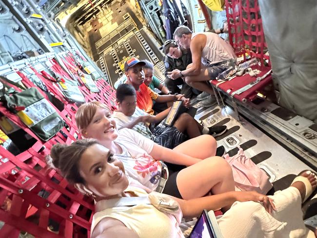 Emerentiana Ningiga takes a picture inside the airplane from Vanuatu. Picture: NewsWire / John Gass