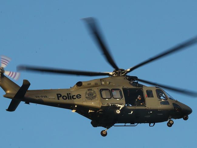 The police air wing in action on a search and rescue operation. Picture: Alison Wynd