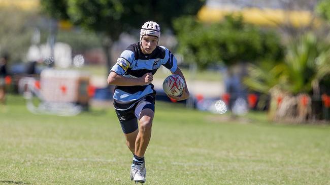 Day One of King of the Country rugby tournament at James Overell Park, Southport. Maroochydore Swans U14s Jarvis Wood in action against USQ Saints U14s (blue white small stripes). Picture: Jerad Williams