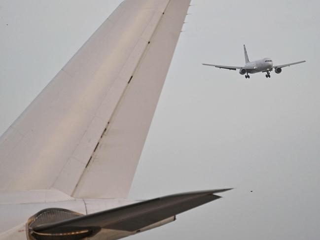 An Eastern Air Lines plane carrying Venezuelan migrants repatriated from the US lands at Simon Bolivar International Airport in Maiquetia, Venezuela, on April 4, 2025. (Photo by JUAN BARRETO / AFP)