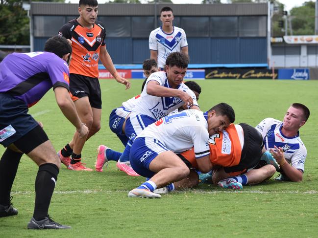 Josh Feledy is tackled by Lejuan Vito. Picture: Sean Teuma/NewsLocal