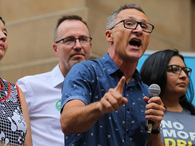 NSW Greens MP David Shoebridge stands behind Greens leader Richard Di Natale (front) in support of pill testing at festivals, alongside Greens Senator Mehreen Faruqi. Picture: Steven Saphor