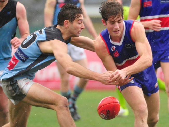 Keilor's Joseph Ciranna and Aberfeldie’s Jess Rush battle for possession. Picture: Jamie Morey