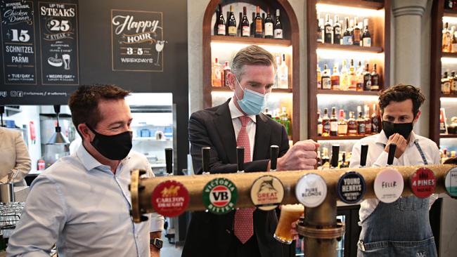 Paul Toole and Premier Dominic Perrottet pour a beer at Watson's pub in Moore Park. Picture: NCA NewsWire / Adam Yip