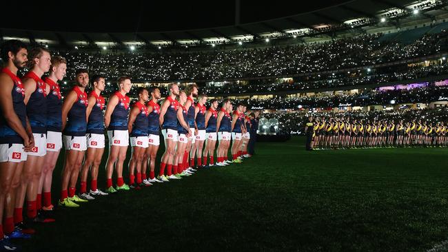 Melbourne and Richmond players line up before last year’s clash. Pic: Michael Klein