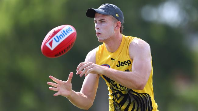 GOLD COAST, AUSTRALIA - JANUARY 30: Callum Coleman-Jones handballs during a Richmond Tigers AFL training session at Southport Sharks on January 30, 2020 in Gold Coast, Australia. (Photo by Chris Hyde/Getty Images)