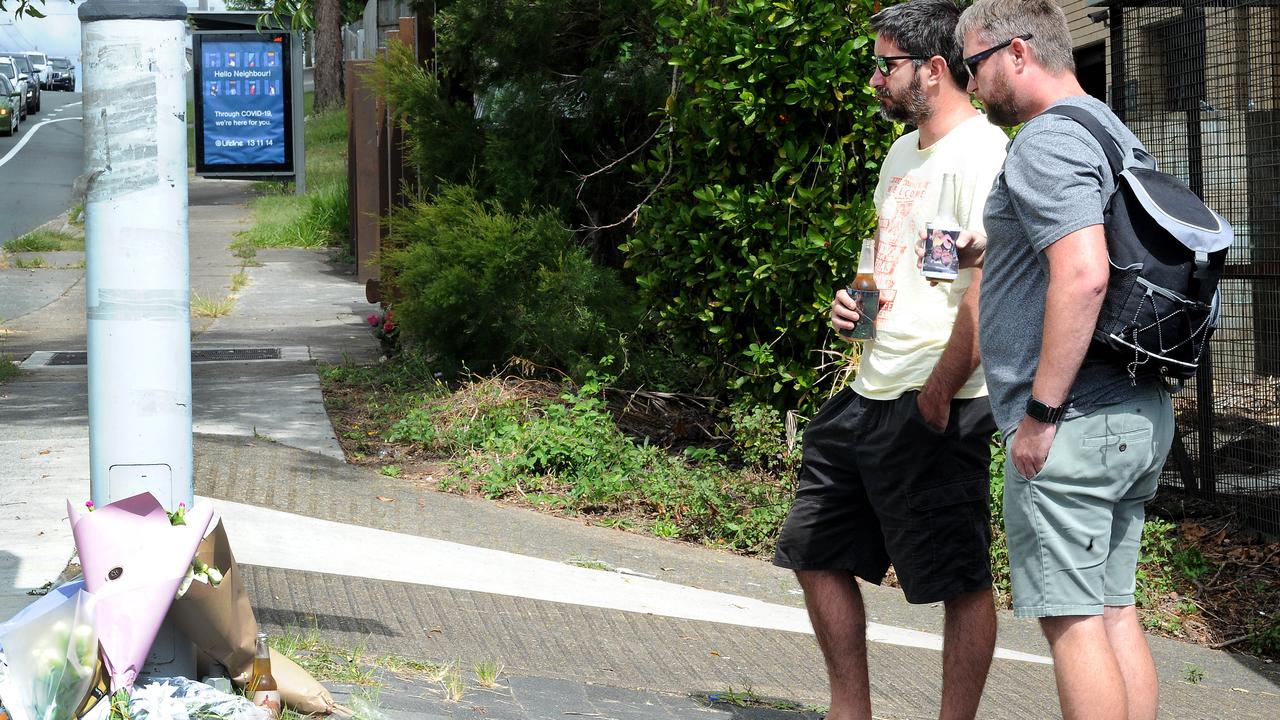 Two mates have a last beer for their friend, killed when struck by an allegedly stolen vehicle in Alexandra Hills. Picture: John Gass