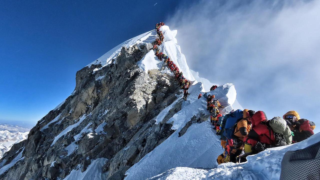 Mountain climbers line up to stand at the summit of Mt Everest. Picture: Handout /@nimsdai Project Possible /AFP)