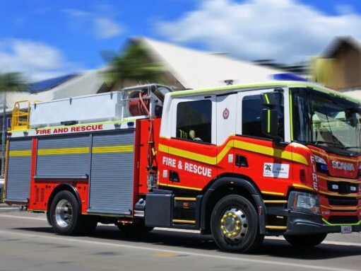 AIRLIE BEAH, QLD - OCT 02 2022:Australian firetruck rushing to scene.The global fire trucks market size was estimated at USD 4.30 billion in 2015.