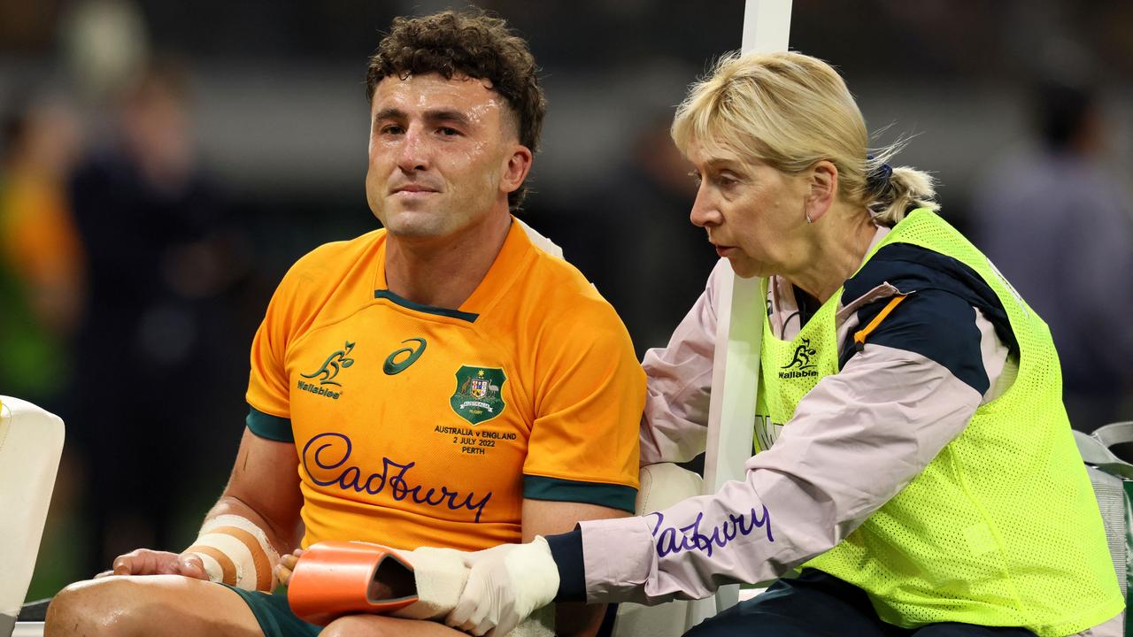 Australia's Tom Banks leaves the field after breaking his arm. Photo: AFP